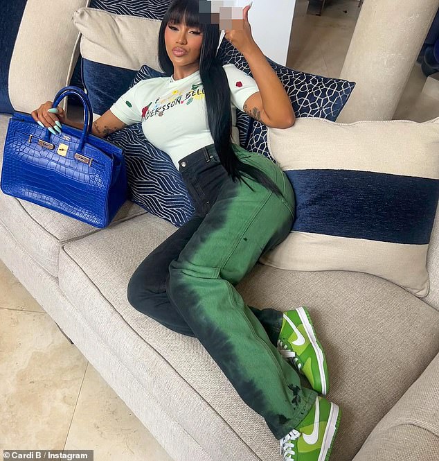 Stylish comfort: Cardi B also added other pH๏τos of herself donning a different ensemble which comprised of a pair of high-waisted jeans that contained various hues of green