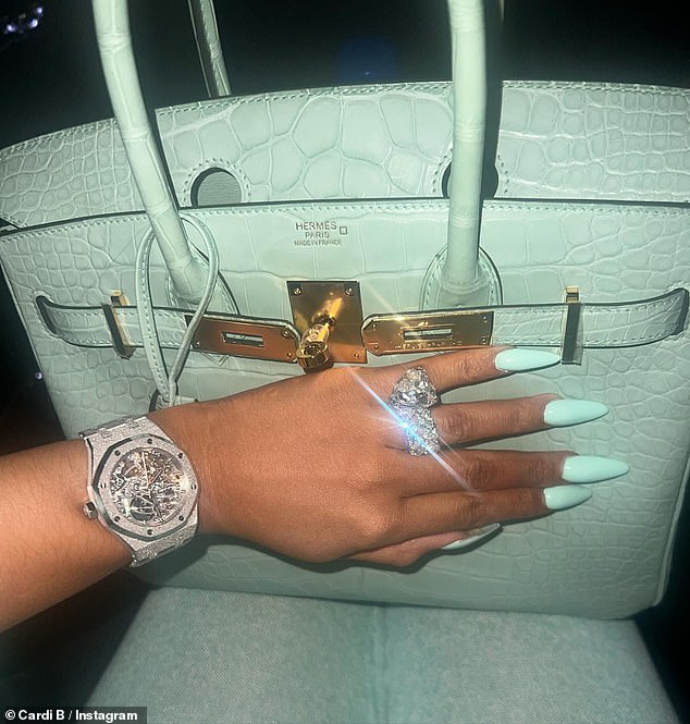 Sparkling diamonds: The final image added into the post was a close-up snap of her hand to show off the sparkling diamond ring on her finger, as well as the luxurious Hermes bag