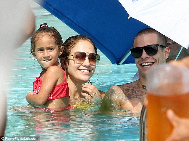 Good times: Emme, J-Lo and Casper hopped under the shade of an umbrella while in the pool