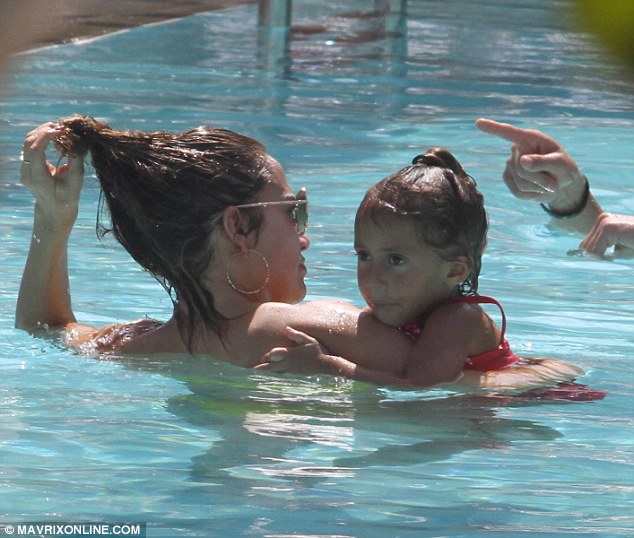 In deep: Lopez was quickly joined by her daughter Emme, who clung to her mother in the pool