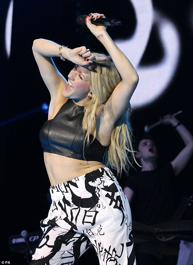 That must be sweaty: Ellie opted to wear a rather tight leather crop top for her performance