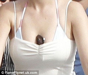 Call my cleavage: Katy Perry put her phone in between her breasts
