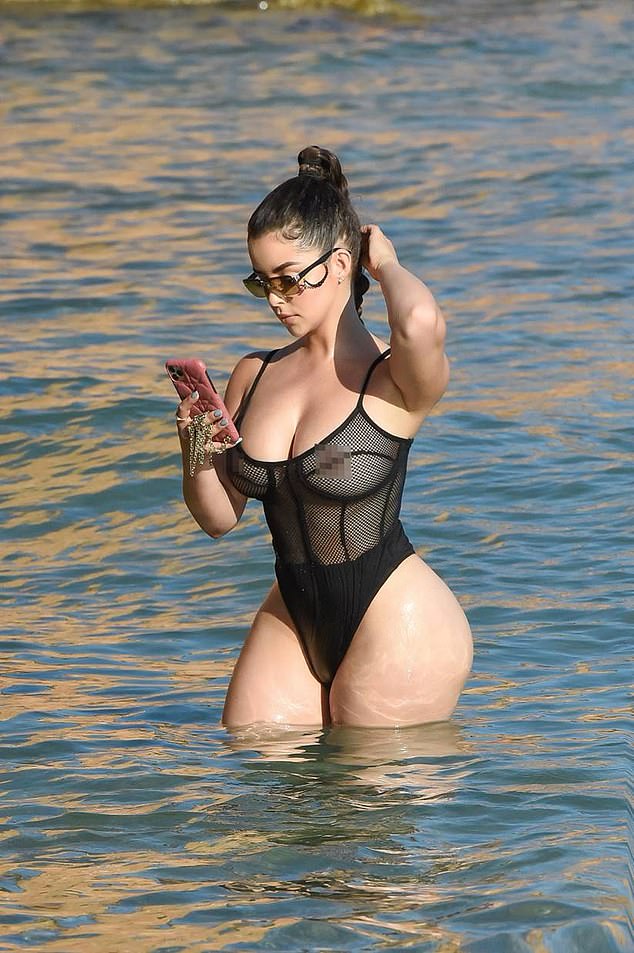 Racy display: Demi Rose put on a scintillating display as she headed to the beach in Ibiza in a completely sheer mesh PrettyLittleThing swimsuit on Tuesday