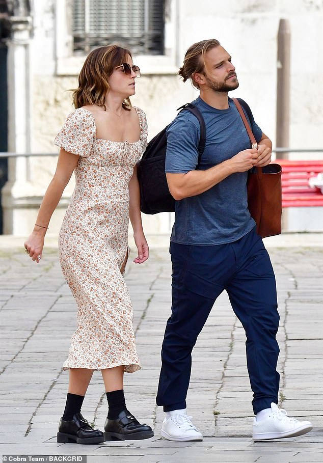 Duo: Emma Watson cut a chic figure as she joined new beau Brandon Green for a scenic day in Venice recently