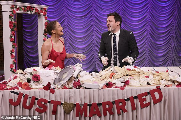 Having fun: Lopez won the first two games, but lost to Fallon on the third challenge, which had them digging through two wedding cakes to find a wedding ring