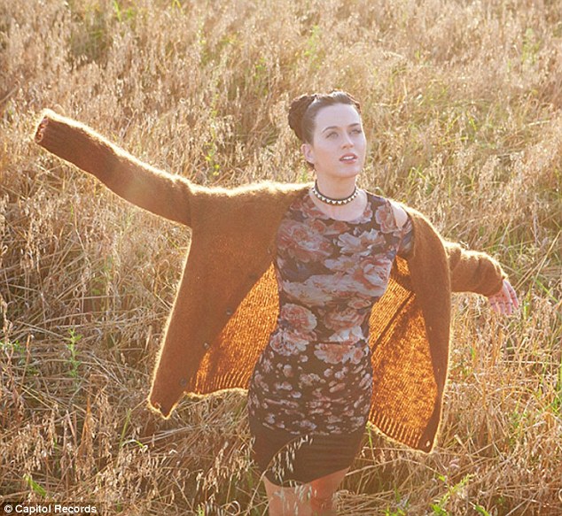 Wild: The singer looks quite at home in the field wearing a pretty floral dress