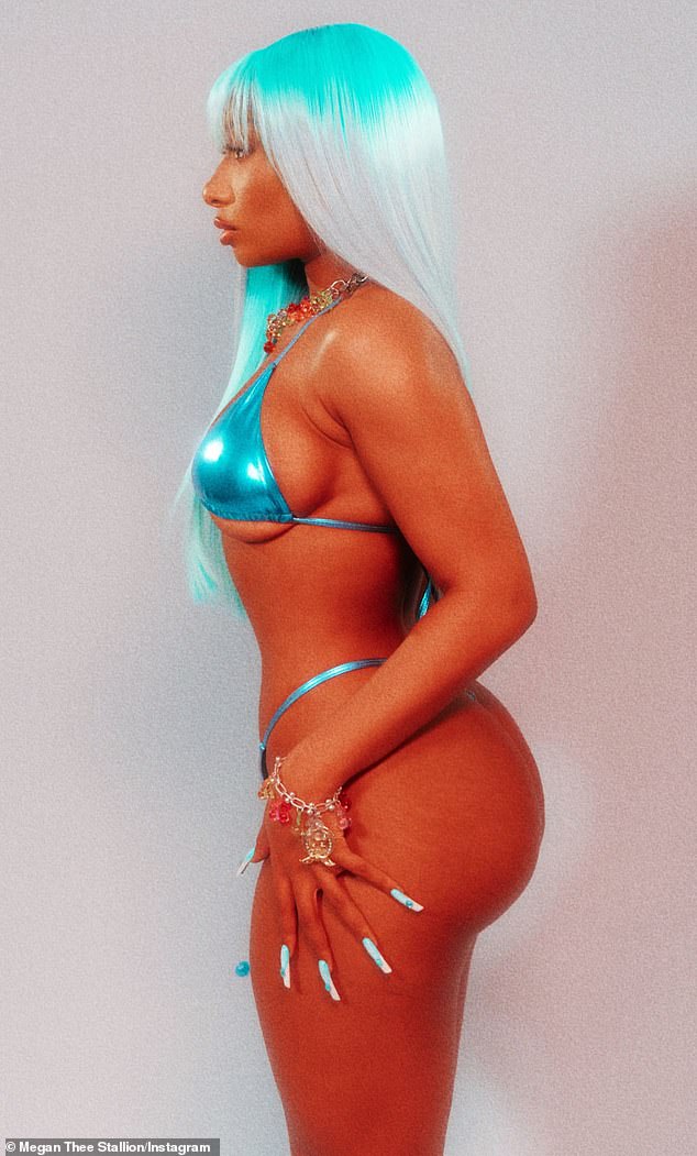 Blue-tiful: The award-winning rapper showed off her toned body and pert derriere