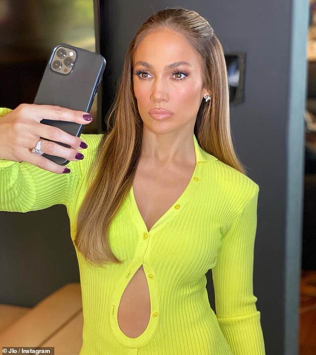 Working it: Jennifer Lopez shared sexy selfies in a figure-hugging neon dress... after enjoying a family day out with beau Ben Affleck