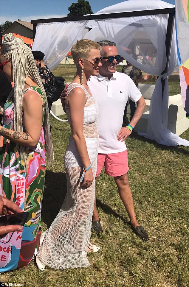 Strike a pose: The star posed for pH๏τos with fans, beaming as she enjoyed the sunshine at the launch of her new footwear range 