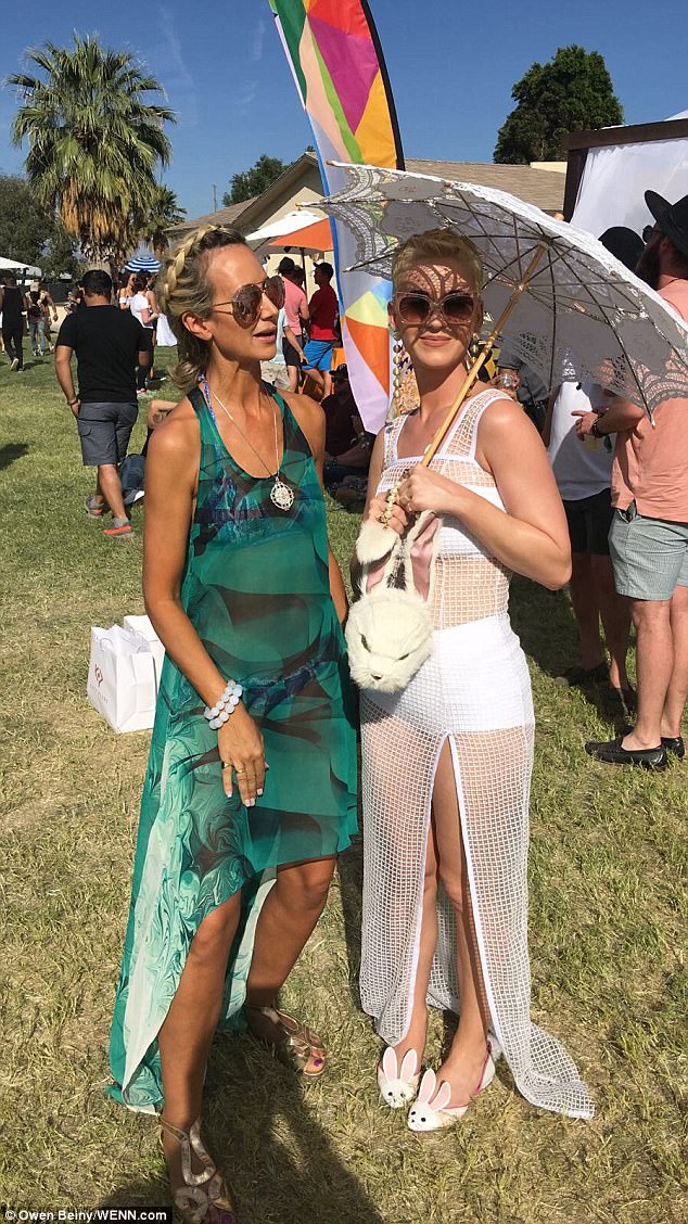 Festival friends: Katie posed up a storm with Lady Victoria Hervey at the event 
