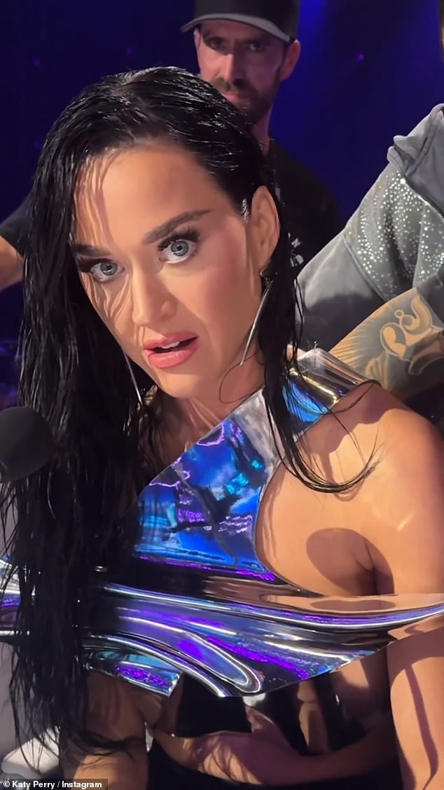 Katy Perry felt the full power of music on Monday night's episode of American Idol , joking that a performance had made her top break