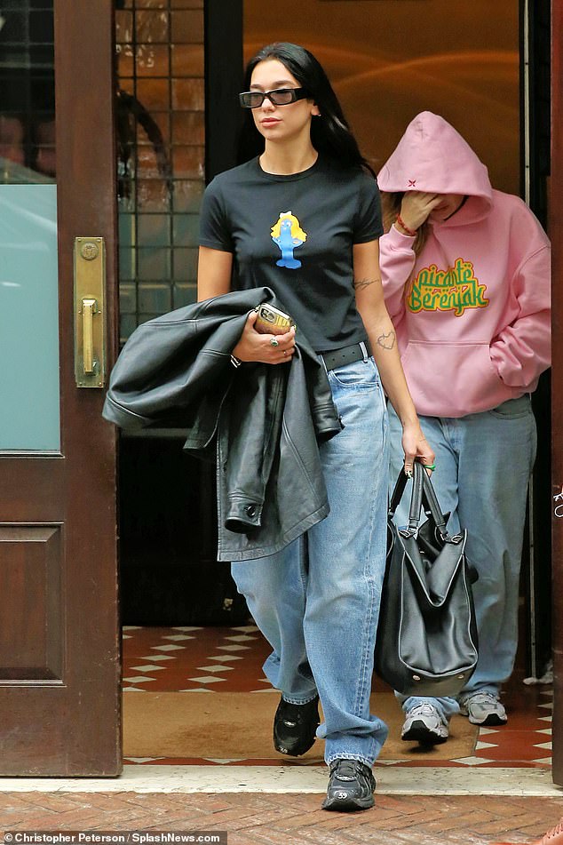 Rumors swirl: Dua Lipa was spotted leaving the Greenwich H๏τel in Tribeca on Saturday, days after she was seen on a date with Daily Show host Trevor Noah