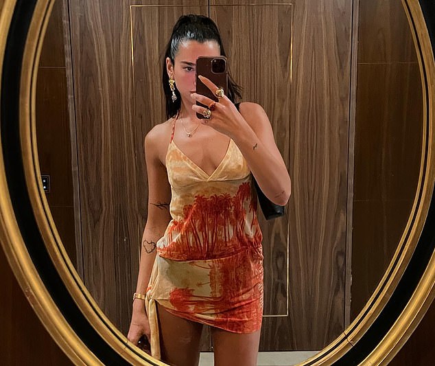 Night out: Dua Liba, 26, flaunted her incredible figure in a stunning silk co-ord as she enjoyed a night on the tiles in Lisbon during her Future Nostalgia tour on Tuesday