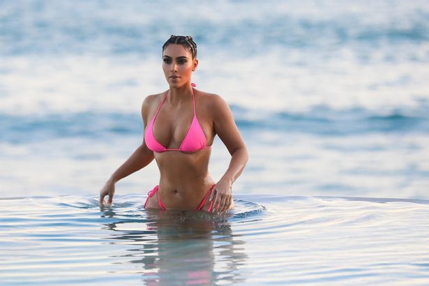 Kim Kardashian strips down to pink ʙικιɴι in Mexico to frolic alone on the  beach - Mirror Online