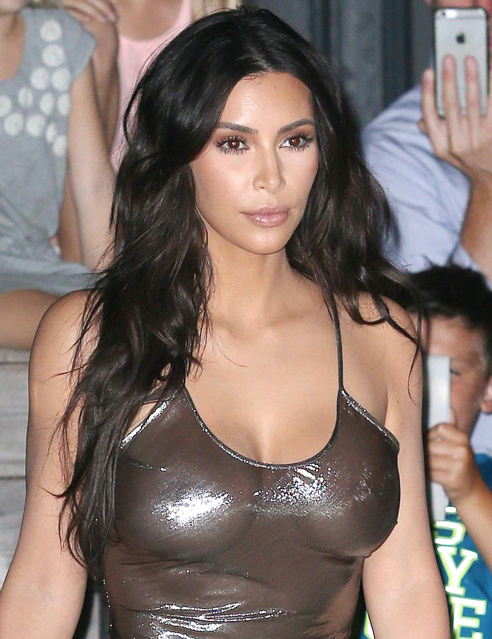  Kim Kardashian shimmers in a see-through dress