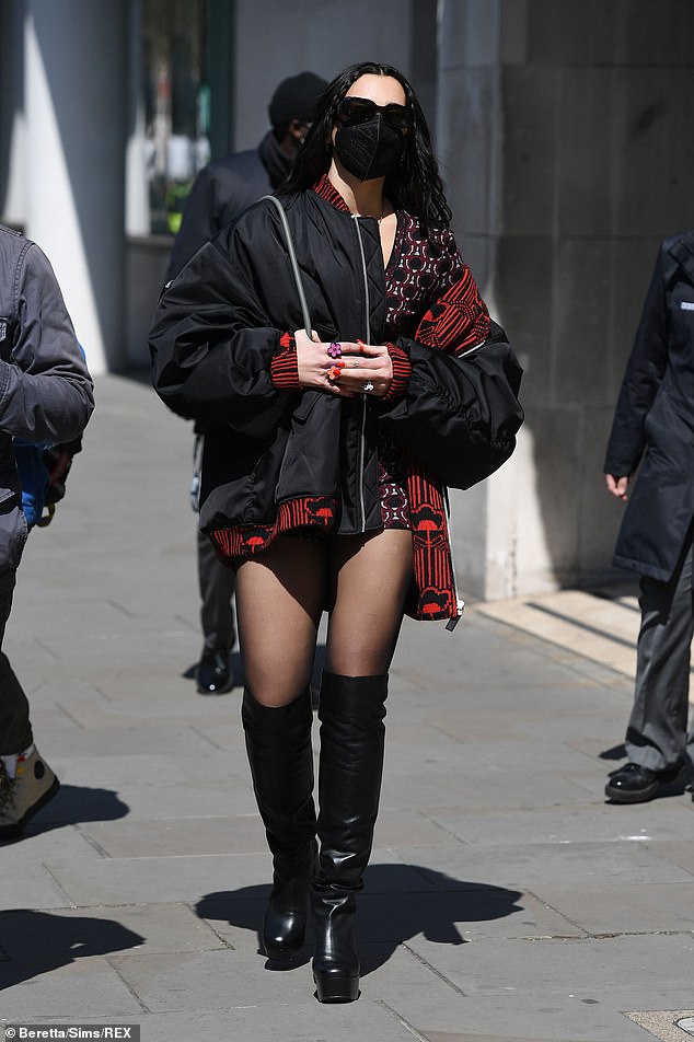 Stylish: Dua Lipa, 25, effortlessly showcased her fashion credentials on Monday, when she left London's Radio 1 offices in a pair of knee-high platform leather boots