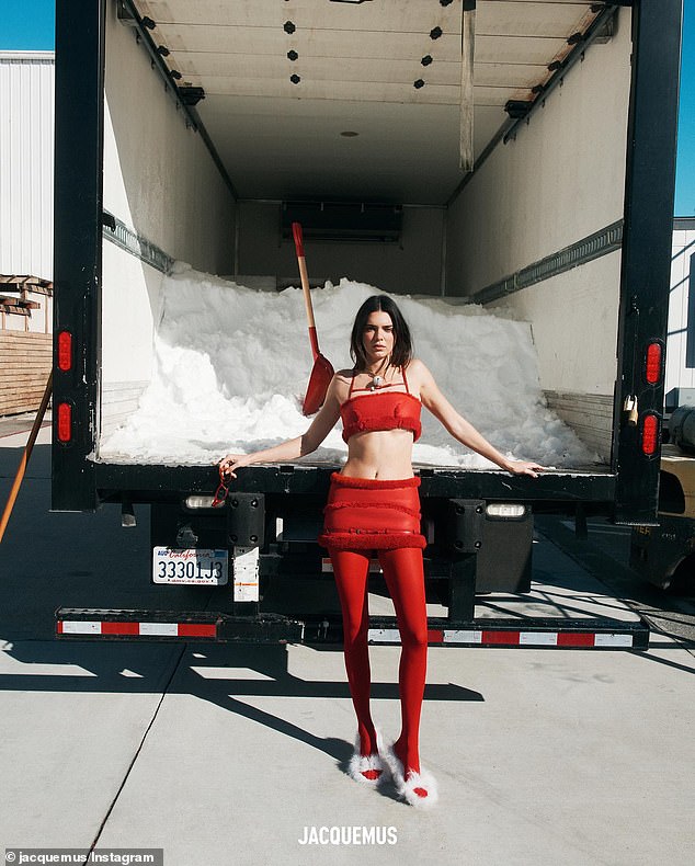 Red H๏τ: Kendall Jenner sizzled in new pH๏τos from Jacquemus' holiday campaign. The 28-year-old model was red H๏τ in a crimson, fur-lined crop top teamed with the matching, low-rise miniskirt as she posed in front of semi-truck full of snow