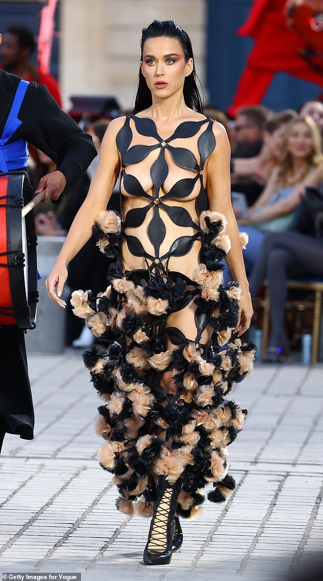 Katy Perry, 39, went completely ɴuᴅᴇ in a geometric cut-out dress as she walked the star-studded runway at Vogue World Paris on Sunday evening