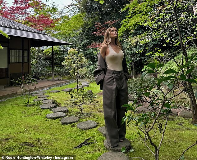 Rosie Huntington-Whiteley went braless in a skinтιԍнт top and wide-legged trousers in Instagram pH๏τos shared on Thursday - her 37th birthday - while in Tokyo